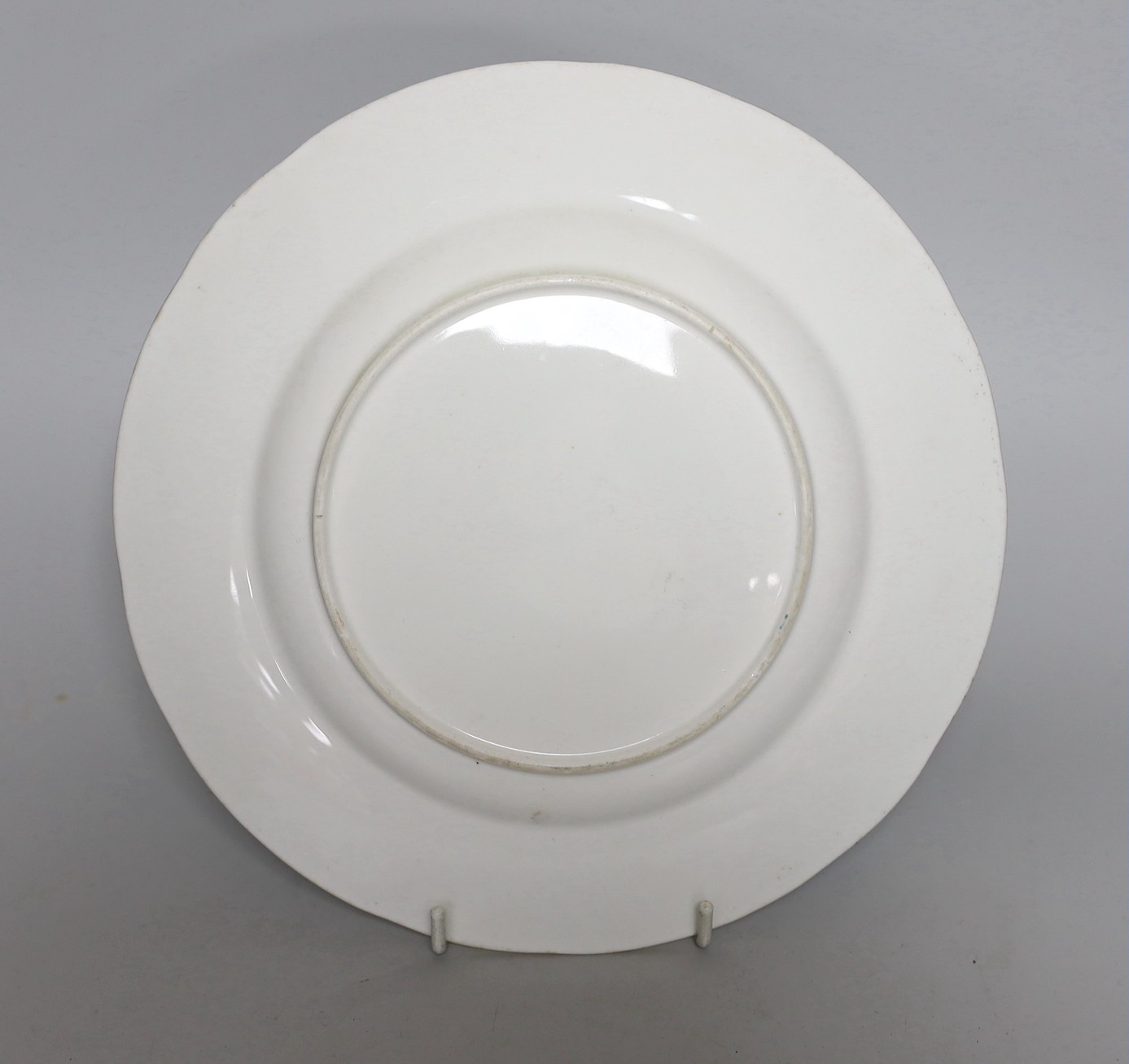 A Minton plate painted with fruit under a turquoise border, 23cm